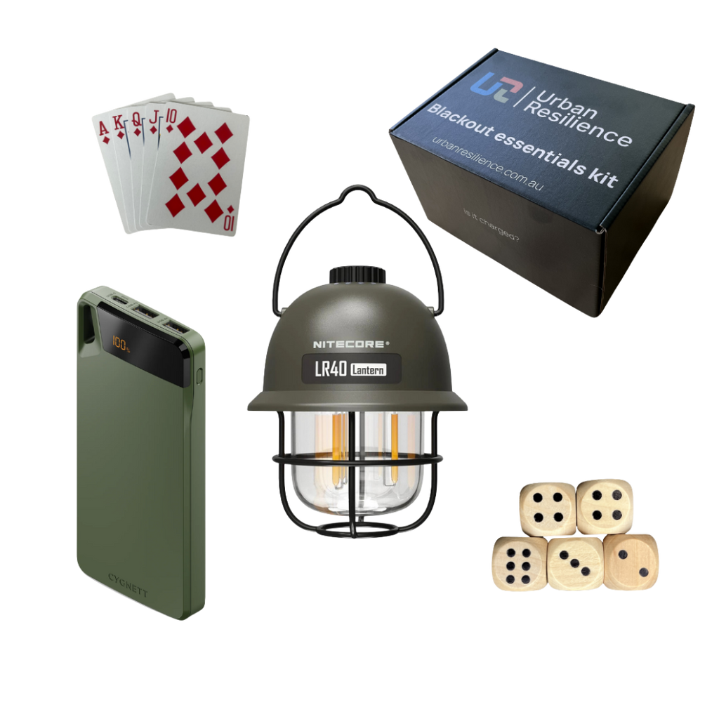 Collection of items including a lantern, power bank, dice, and playing cards with Urban Resilience kit packaging.