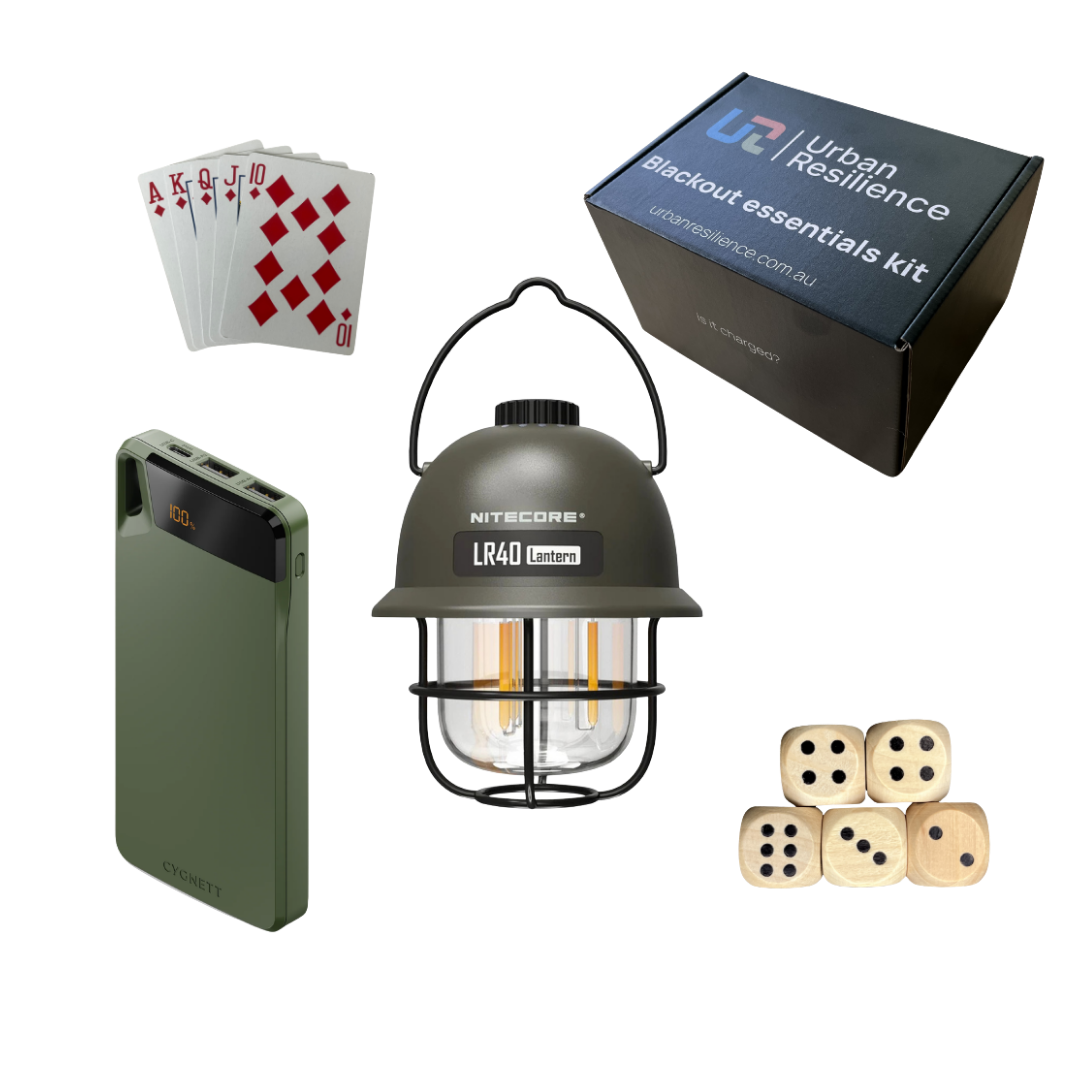 Collection of items including a lantern, power bank, dice, and playing cards with Urban Resilience kit packaging.
